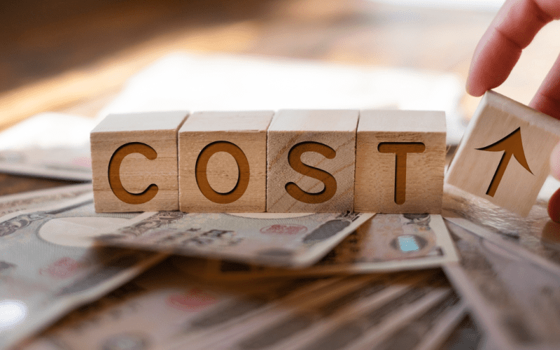 Rising costs concept with yen currency.
